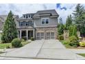 Beautiful two-story home with a brick and gray shingle exterior and a two-car garage at 11210 Easthaven Pl, Duluth, GA 30097