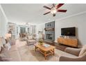 Comfortable living room featuring a fireplace, built-in bookshelves, and stylish furniture at 2156 Fairway Cir, Duluth, GA 30096