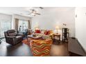 Spacious living room with hardwood floors and neutral paint throughout at 7779 Haynes Park Cir, Lithonia, GA 30038