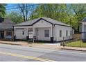 Renovated home featuring a classic design with modern colors, a porch, and landscaping at 1515 Jonesboro Rd, Atlanta, GA 30315