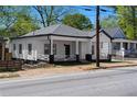 Charming home with a classic design, modern colors, a spacious porch, and landscaped front at 1515 Jonesboro Rd, Atlanta, GA 30315