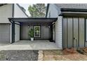 A lovely front porch and entrance featuring stylish decor and a welcoming ambiance at 226 Sandra Nw Dr, Lilburn, GA 30047