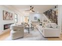Inviting living room with a modern fireplace, comfortable seating, and hardwood floors at 3840 Wieuca Ne Ter, Atlanta, GA 30342