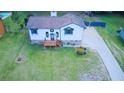Expansive aerial view of the home with a spacious yard, driveway, and exterior details at 4270 Mountain Glen Trce, Snellville, GA 30039