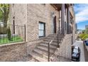 Charming brick entrance with steps leading to a covered porch and detailed front door at 631 Boulevard Ne, Atlanta, GA 30308
