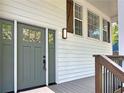 Stylish front door with sidelight and sidelight offers a welcoming entrance to the home at 319 Primrose Ln, Auburn, GA 30011