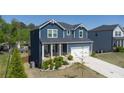 Charming two-story home with a welcoming front porch and well-kept landscaping at 3690 Summerpoint Xing, Cumming, GA 30028