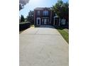 Charming townhome featuring a private entrance and long driveway at 5897 Strathmoor Manor Cir, Lithonia, GA 30058