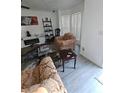 Comfortable living room featuring a cozy seating arrangement and bright, natural light at 5897 Strathmoor Manor Cir, Lithonia, GA 30058