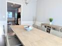 Spacious dining room features a large table, chair, and a view into the kitchen at 3419 Mulberry Cove Way, Auburn, GA 30011
