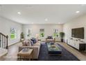 Cozy, furnished living room with a plush sofa, stylish decor, and an inviting atmosphere at 1290 Firefly Field Trce, Lawrenceville, GA 30045