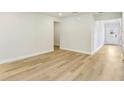 Bright and airy living room featuring pristine white walls, light wood flooring, and a welcoming atmosphere at 241 Martin Spring Rd, Lawrenceville, GA 30045