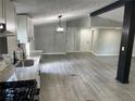 Open concept kitchen showcasing granite countertops, updated cabinets, a breakfast bar, and new appliances at 106 Evergreen Trl, Cartersville, GA 30121