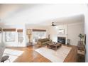 Bright and inviting living room with hardwood floors, fireplace, and natural light at 2019 Chelton Se Way, Smyrna, GA 30080