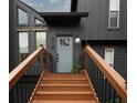 A close-up of the home's entry steps and front door showing detailed architectural features and design at 315 Mckees Rock Ln, Lawrenceville, GA 30044