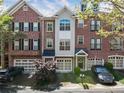 Attractive townhouse exteriors with brick and siding, well-manicured landscaping, and private garages at 5523 Glenridge Ne Park, Atlanta, GA 30342