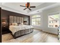 Spacious main bedroom featuring a tray ceiling, large windows, and stylish decor at 5523 Glenridge Ne Park, Atlanta, GA 30342