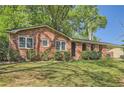 Charming brick home with meticulously maintained landscaping at 751 Oneta Dr, Norcross, GA 30093