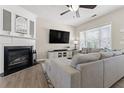 Comfortable living room features a fireplace, large television, a sectional couch, and a big window at 1711 Taynton Cir, Kennesaw, GA 30152