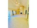 Spacious living room featuring a fireplace, vaulted ceilings, carpeted floors, and natural light at 25 Derby Dr, Hiram, GA 30141