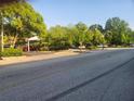 Street view of a building and parking lot with mature landscaping at 1133 Church St # 6, Covington, GA 30014