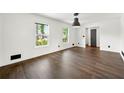 Inviting living room showcasing warm, wood-look floors, bright white walls, and plenty of natural light at 2302 Aurie Dr, Decatur, GA 30034
