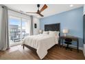 Bright bedroom with a bed, a desk, and a balcony with a view at 383 Pratt Se Dr # 506, Atlanta, GA 30315