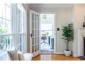 Bright living room featuring French doors leading to a cozy, decorated office space at 333 Mimosa Dr, Decatur, GA 30030