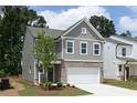 Charming two-story home with brick accents, a two-car garage, and a well-manicured lawn at 612 Belshire Dr, Acworth, GA 30102
