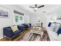 Bright living room features hardwood floors, a ceiling fan, and large window at 1222 Crestwood Se Dr, Atlanta, GA 30316