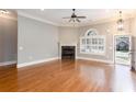 Spacious living room with hardwood floors, fireplace, and large windows at 1640 Arbor Green Nw Ct # 1102, Kennesaw, GA 30152