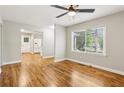 Bright room featuring hardwood floors, a ceiling fan, and an open floor plan at 3417 Glen Rd, Decatur, GA 30032