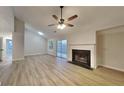 Open living space with fireplace, lots of natural light and a ceiling fan at 3640 Sapphire Ct, Decatur, GA 30034