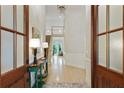 Grand foyer featuring high ceilings, a staircase, wood floors, and abundant natural light at 3803 Mill Creek Ct, Atlanta, GA 30341
