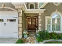 Inviting entrance featuring stone pathway, wood double doors, and manicured landscaping at 3803 Mill Creek Ct, Atlanta, GA 30341