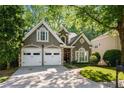 Charming home with a well-manicured lawn, two car garage and mature trees in a beautiful neighborhood at 3803 Mill Creek Ct, Atlanta, GA 30341