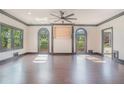 Expansive living room featuring hardwood floors, large windows offering natural light, and unique architectural details at 1751 Bergen Ct, Lawrenceville, GA 30043