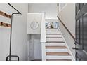 Inviting entryway with staircase, coat rack, and 'Welcome' sign, leading into a bright, open living space at 41 Jessica Ln, Dallas, GA 30157
