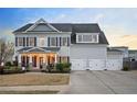 Beautiful two-story home with a spacious three-car garage and inviting front porch at 524 Tackett Farms Rd, Smyrna, GA 30082