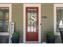 Close-up of the front door with a decorative 'S' and a 'Welcome' sign at 9988 Devonshire St, Douglasville, GA 30135