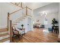 Open floor plan with hardwood floors and staircase leading to the second floor at 1555 Olympian Sw Way, Atlanta, GA 30310