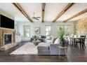 Inviting living room featuring a brick fireplace and an abundance of natural light at 4496 Sardis Church Rd, Buford, GA 30519