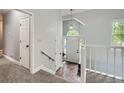 Bright foyer with tile flooring, and staircase to the second story at 5640 Rolling Oaks Dr, Cumming, GA 30040