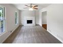 Bright living room features neutral tones, a fireplace, and fresh carpet at 2390 Century Ln, Snellville, GA 30039