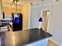 A kitchen with an island bar, stainless steel sink, and modern appliances at 2479 Ne Peachtree Ne Rd # 1112, Atlanta, GA 30305