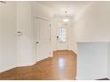 Inviting foyer with hardwood floors, white walls, and natural light from the front door at 3365 Vintage Se Cir, Smyrna, GA 30080
