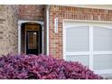 Charming townhome featuring an attached garage and a well-maintained brick facade, and a tidy landscape at 3365 Vintage Se Cir, Smyrna, GA 30080