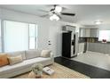 Bright living room open to the kitchen with stainless appliances and an adjacent living room area at 110 Ridge Se Ct, Mableton, GA 30126