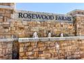 Stone monument sign for Rosewood Farms with decorative water features in the landscaping at 2617 Cacao Sq, Acworth, GA 30101