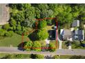 Aerial view of property showing the house and surrounding tree lined lot at 30 Village Dr, Cartersville, GA 30121